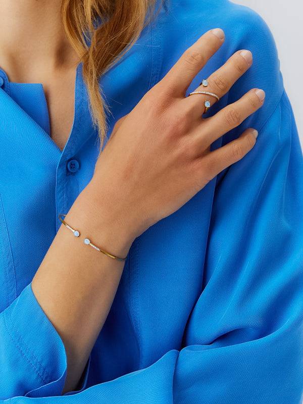 Nanis Anello ad incrocio "DANCING AZURE" in oro, diamanti e acquamarina – Nanis Italian Jewels Italia